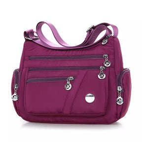 Bolsa Transversal Feminina Impermeável Maitê, Bolsa Transversal Roxa, Bolsa Impermeável, Bolsa Transversal com Muitos Bolsos, Bolsa Feminina a Prova D'água, Bolsa Feminina de Ombro, Bolsa Roxa - lojamillani