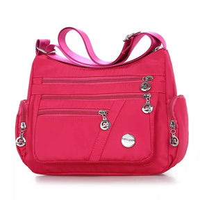 Bolsa Transversal Feminina Impermeável Maitê, Bolsa Transversal Rosa, Bolsa Impermeável, Bolsa Transversal com Muitos Bolsos, Bolsa Feminina a Prova D'água, Bolsa Feminina de Ombro, Bolsa Rosa - lojamillani